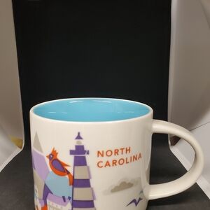 North Carolina Souvenir Mug with Blue Interior. No chips,cracks or stains.